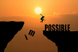 csm_man-jumping-impossible-possible-cliff-sunset-background-business-concept-idea_0a518e51fc